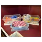 Dish towels and rags in 3 plastic shoe boxes