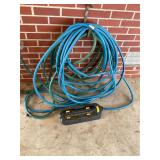 Two garden hoses and sprinkler