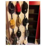12 assorted hats, and door hat holder