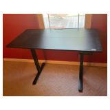 Standing computer table with plug