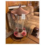 Glass hummingbird feeder copper color