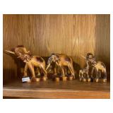 3- light wooden elephants