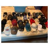 36 assorted hats and tote