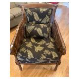 Brown, wooden black and gold flowered chair