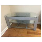 Gray metal and glass TV stand
