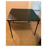 Black folding card table