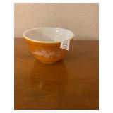 Orange and white Pyrex mixing bowl