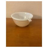 Brown and white Pyrex mixing bowl