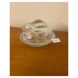 Glass rabbit on a nest