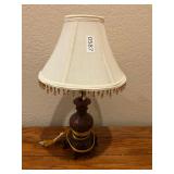 Reddish brown table, lamp, cream, beaded shade