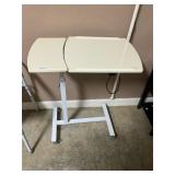 Rolling adjustable tray table