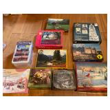 10 assorted puzzles in boxes