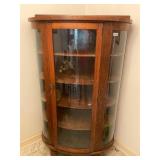 Antique curved glass curio cabinet