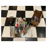 Box full of kitchen utensils and knives