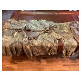 Assorted camouflage pants, shirts all