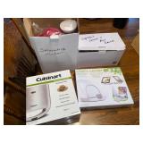 Four small kitchen appliances in boxes