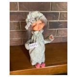 Creepy yawning grandma doll