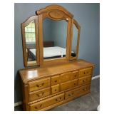 Dresser with trifold mirror