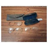 lot of old spectacles and cases