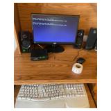 Computer system with speakers, keyboard, desk misc