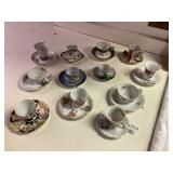 12- mini tea cups and saucers