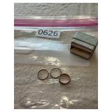 Three baby rings.  Two marked gold