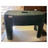 Green plastic stool