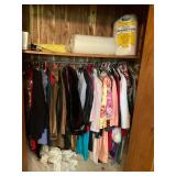 Closet full of jackets, wedding dress most large