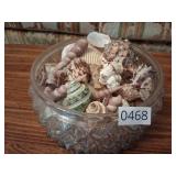 Large glass bowl of sea shells