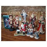 collection of tall santa figurines