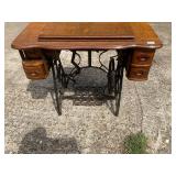 Treadle base sewing cabinet