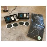 2 opened nooro body massagers, extra pads