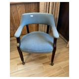 Blue rolling armchair