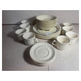 Old cream colored dishes with blue floral pattern