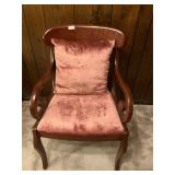 Wood and mauve colored fabric chair