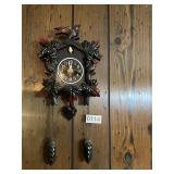Miniature black cuckoo clock