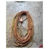Large Orange extension cord with 3 plug end