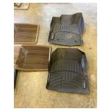 4 floor mats. 2 weather tech