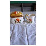 Merry Mushroom napkin holder and creamer pitcher
