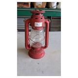 Red winged wheel oil lamp