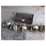 5 casters in metal tray