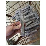 metal basket with lead ingots