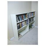 2 White Shelving Units Filled with Books