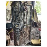 Metal Framed Panel Rack with Chains, Hoses, and Pulley System