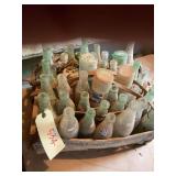 Collection of Various Old Bottles in Wooden Carrier