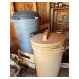 Small pet carrier and two plastic trash cans