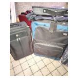 Assorted Suitcases and Violin Case