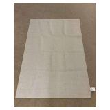 Tan and white patterned rug