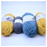 Assorted Yarn Skeins in Yellow, Blue, and Gray