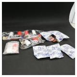 Assortment of Sewing Kits and Buttons